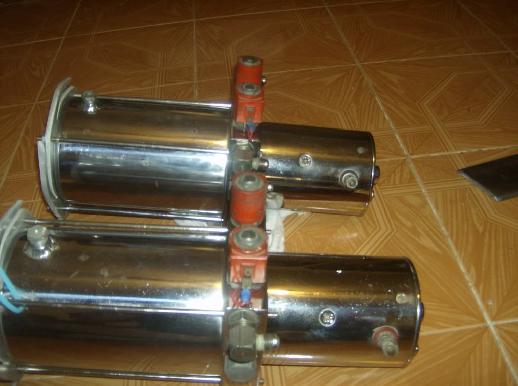 2 Reds old school hydraulic pumps