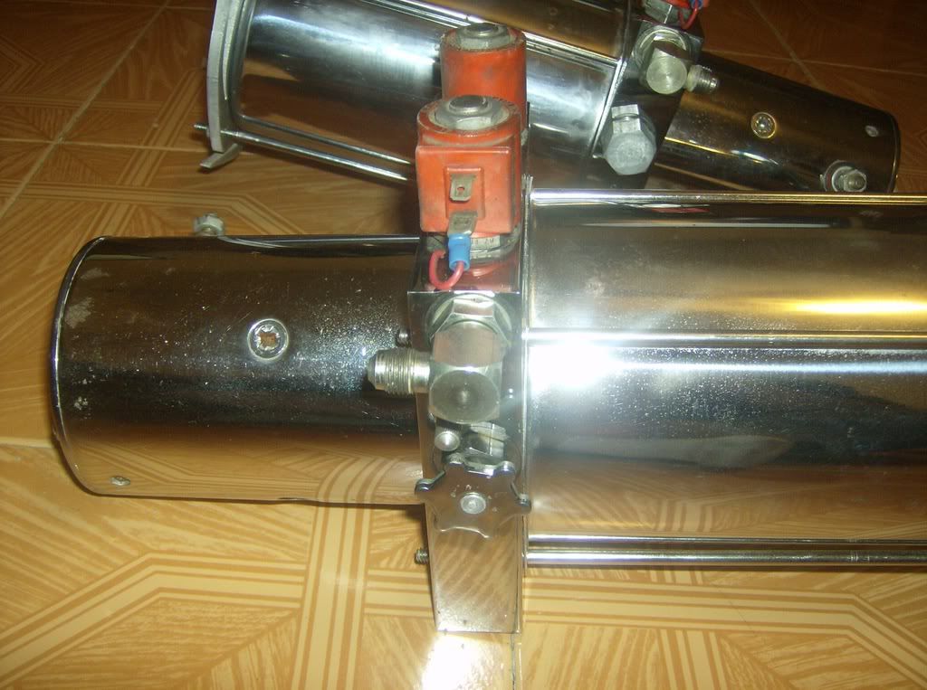 2 Reds old school hydraulic pumps