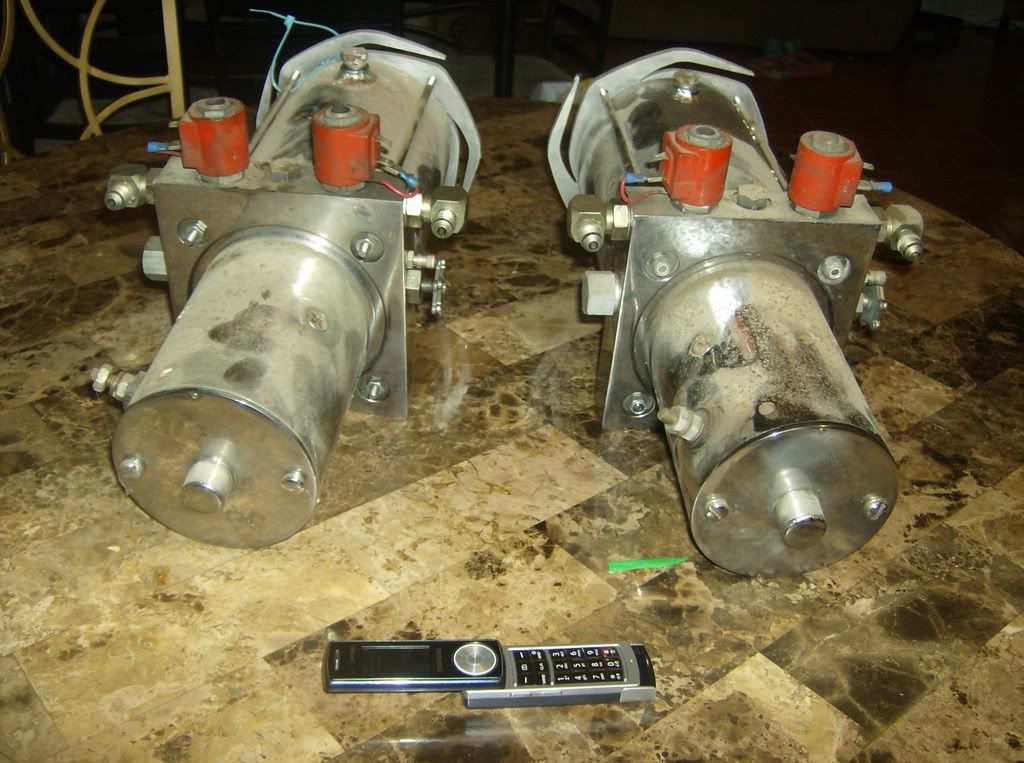 2 Reds old school hydraulic pumps